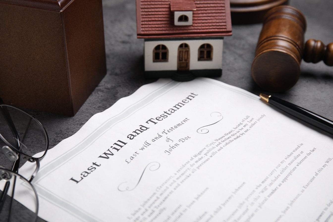 Last Will and Testament near House Model, Glasses and Gavel on G